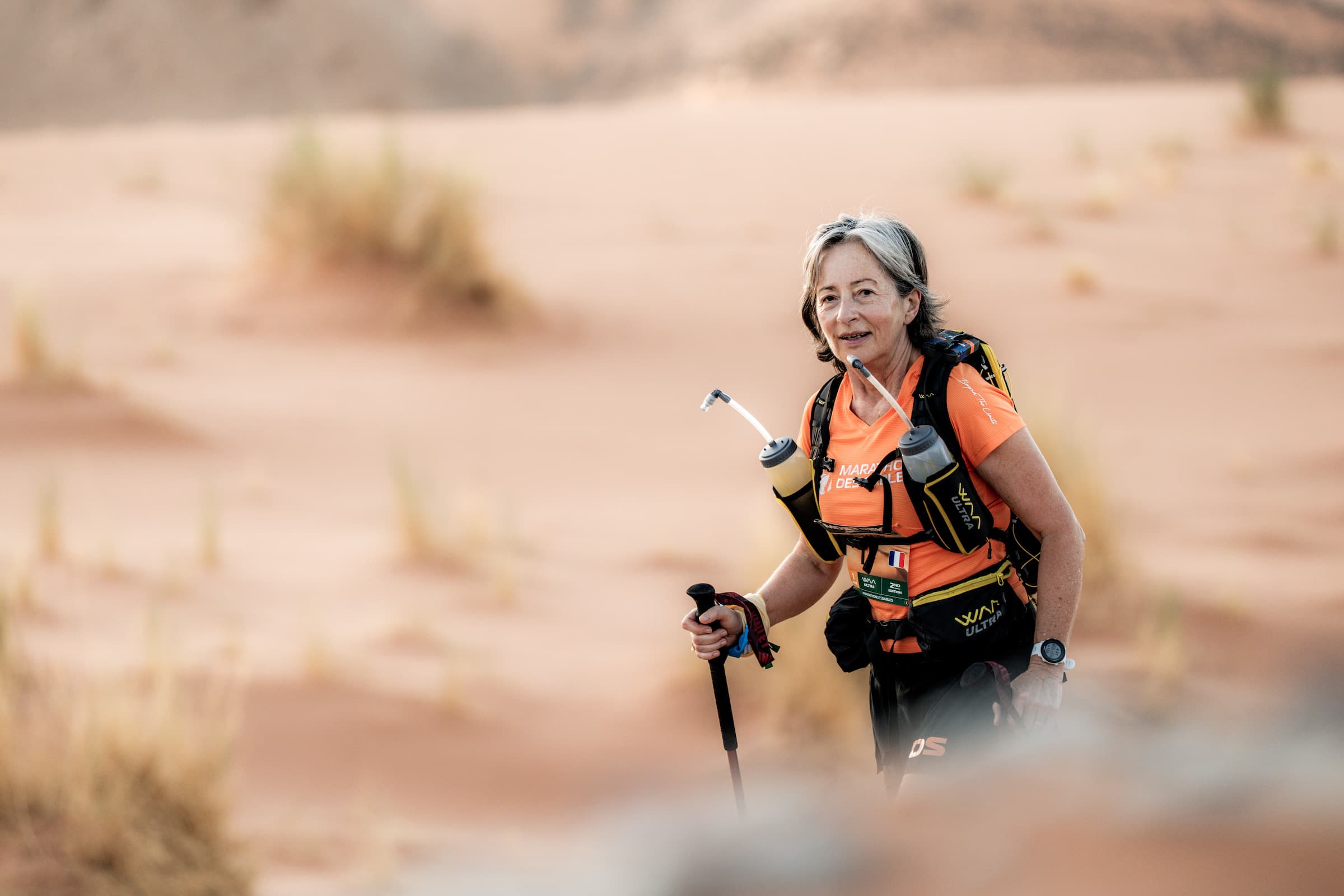 Competitors crossing desert terrain